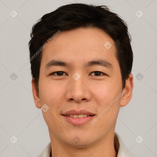 Joyful asian young-adult male with short  brown hair and brown eyes