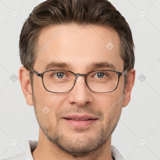 Joyful white adult male with short  brown hair and grey eyes