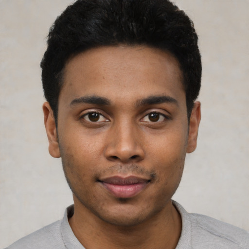 Neutral black young-adult male with short  black hair and brown eyes