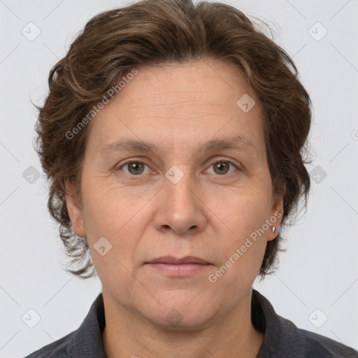 Joyful white adult female with short  brown hair and grey eyes