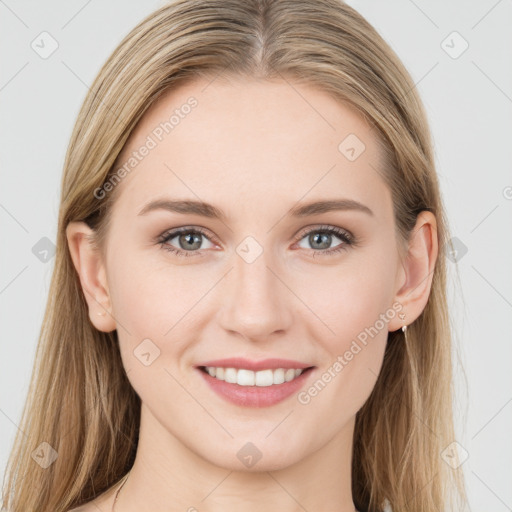 Joyful white young-adult female with long  brown hair and green eyes