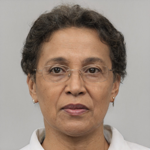 Joyful white middle-aged female with short  brown hair and brown eyes