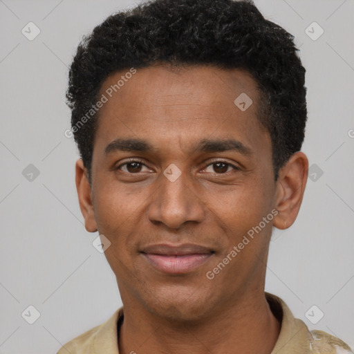 Joyful black young-adult male with short  black hair and brown eyes