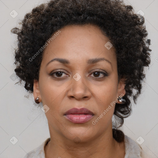 Joyful black adult female with short  brown hair and brown eyes