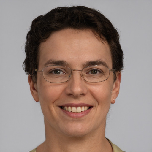 Joyful white adult male with short  brown hair and green eyes