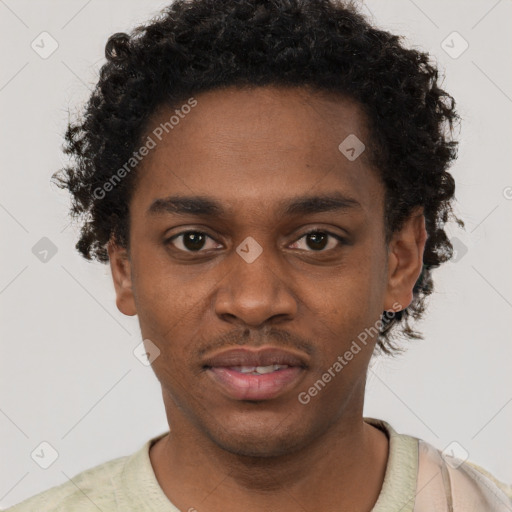 Joyful black young-adult male with short  brown hair and brown eyes