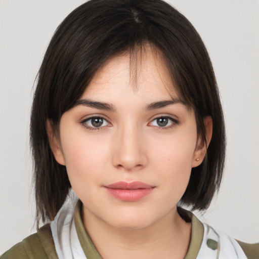 Neutral white young-adult female with medium  brown hair and brown eyes