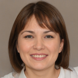 Joyful white young-adult female with medium  brown hair and brown eyes