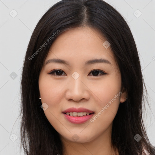 Joyful asian young-adult female with long  brown hair and brown eyes