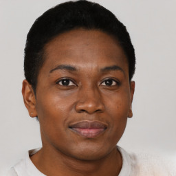 Joyful black adult female with short  brown hair and brown eyes