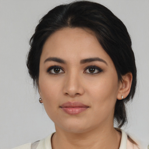 Neutral latino young-adult female with medium  black hair and brown eyes