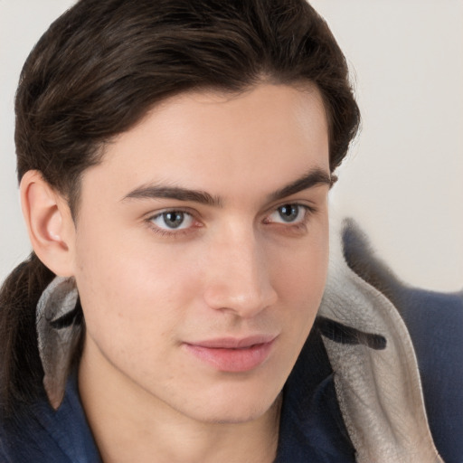 Joyful white young-adult male with medium  brown hair and brown eyes