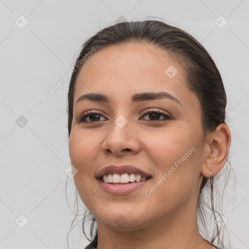 Joyful white young-adult female with long  brown hair and brown eyes