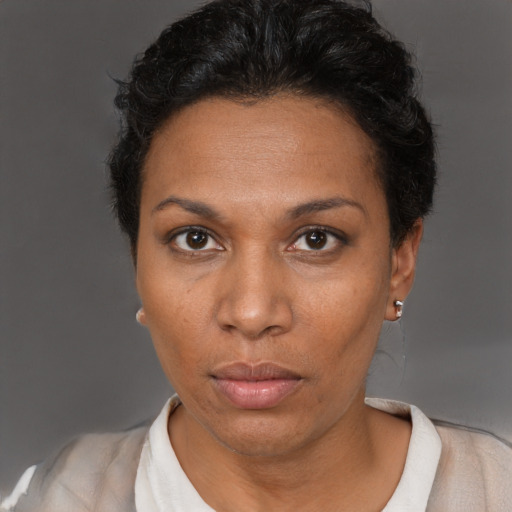 Neutral black adult female with short  brown hair and brown eyes