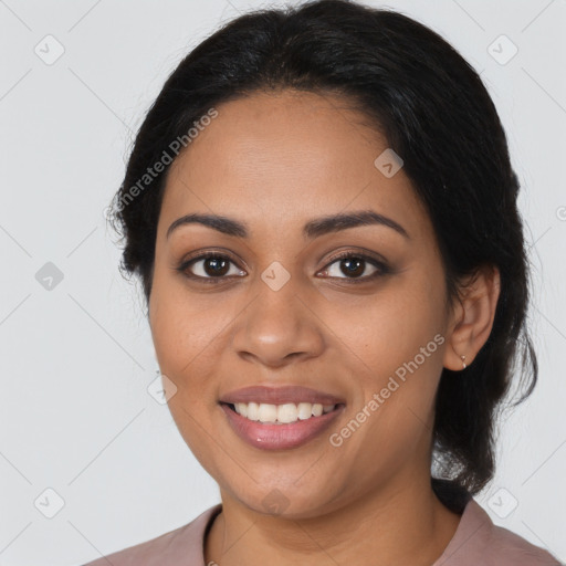 Joyful latino young-adult female with medium  black hair and brown eyes