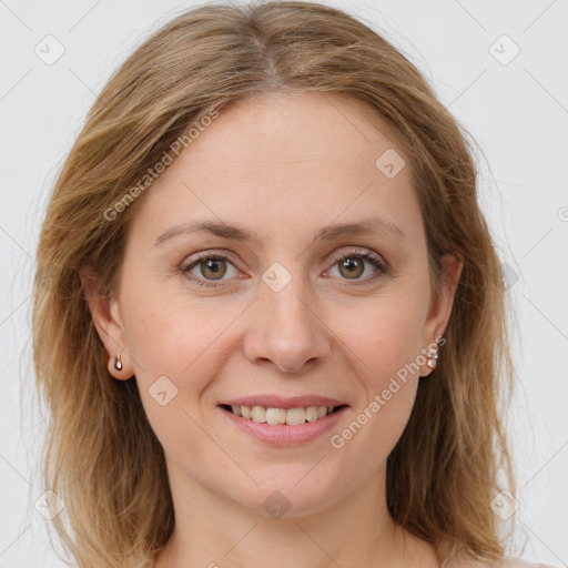 Joyful white young-adult female with long  brown hair and blue eyes