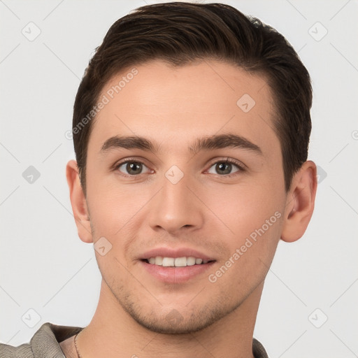 Joyful white young-adult male with short  brown hair and brown eyes