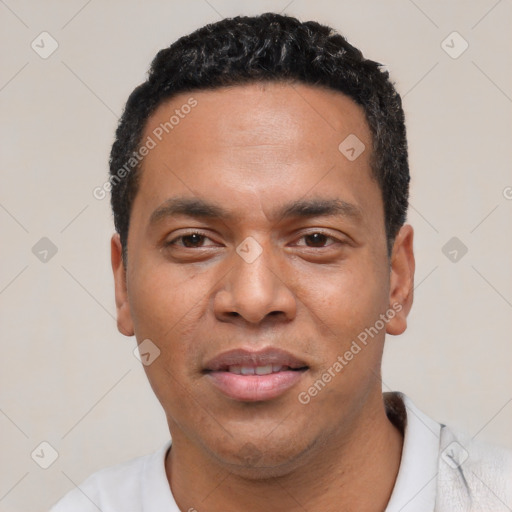 Joyful white young-adult male with short  black hair and brown eyes