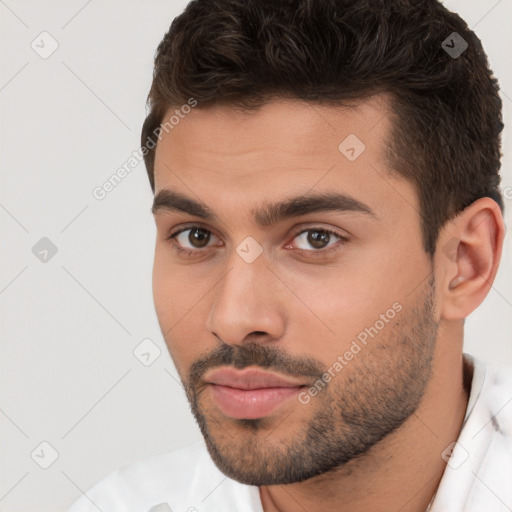 Neutral white young-adult male with short  brown hair and brown eyes