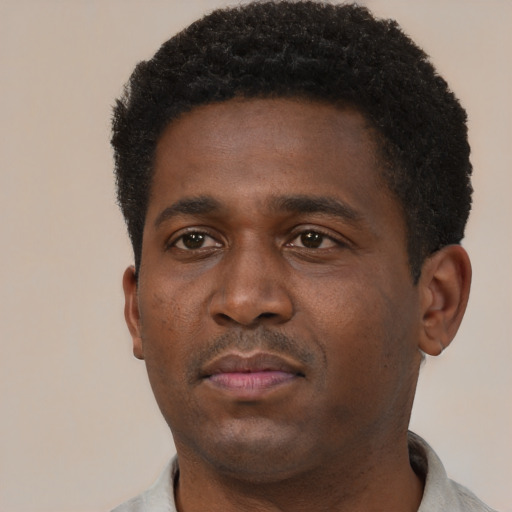 Neutral black young-adult male with short  black hair and brown eyes