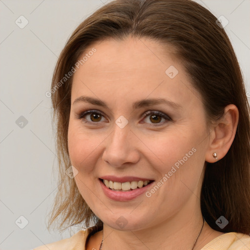 Joyful white young-adult female with medium  brown hair and brown eyes