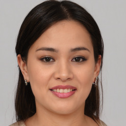 Joyful asian young-adult female with medium  brown hair and brown eyes