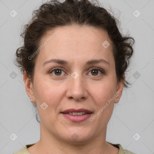 Joyful white adult female with short  brown hair and grey eyes