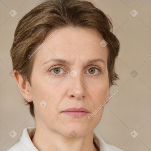 Joyful white adult female with short  brown hair and green eyes