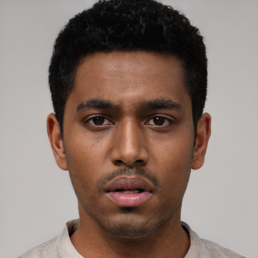 Neutral black young-adult male with short  black hair and brown eyes