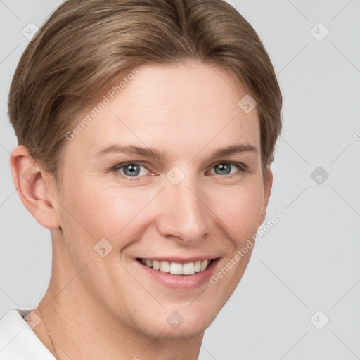 Joyful white young-adult female with short  brown hair and grey eyes