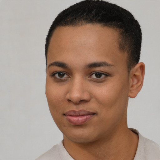 Joyful black young-adult female with short  black hair and brown eyes