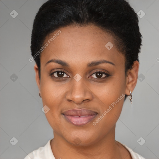 Joyful black young-adult female with short  black hair and brown eyes