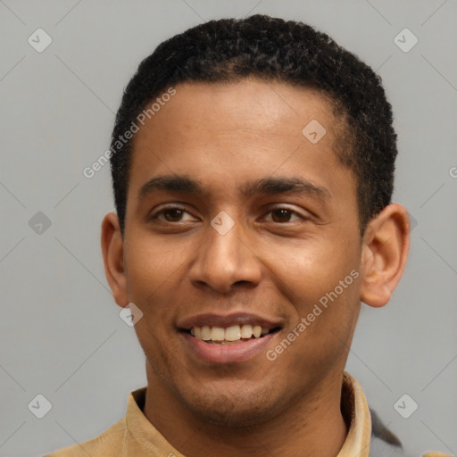 Joyful latino young-adult male with short  black hair and brown eyes