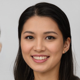 Joyful asian young-adult female with long  brown hair and brown eyes