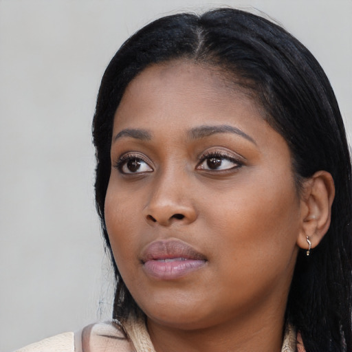 Neutral black young-adult female with long  black hair and brown eyes