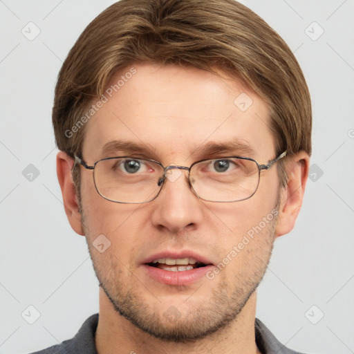 Joyful white adult male with short  brown hair and grey eyes