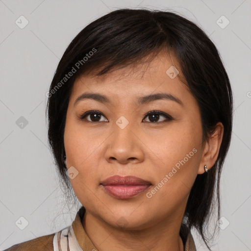 Joyful asian young-adult female with medium  brown hair and brown eyes