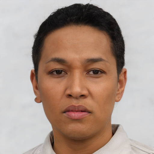 Neutral latino young-adult male with short  black hair and brown eyes