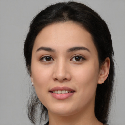 Joyful white young-adult female with long  brown hair and brown eyes