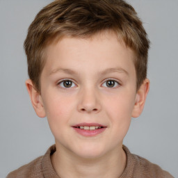 Joyful white child male with short  brown hair and brown eyes