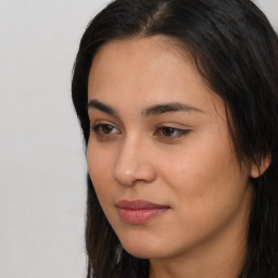 Joyful asian young-adult female with long  brown hair and brown eyes