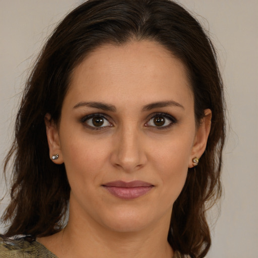 Joyful white young-adult female with medium  brown hair and brown eyes