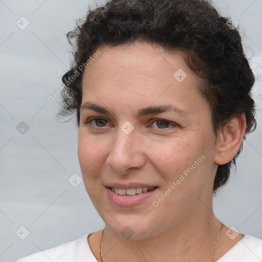 Joyful white adult female with short  brown hair and brown eyes