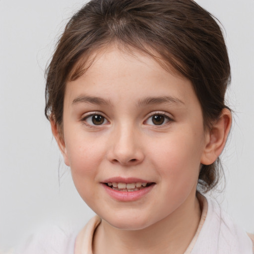 Joyful white child female with medium  brown hair and brown eyes