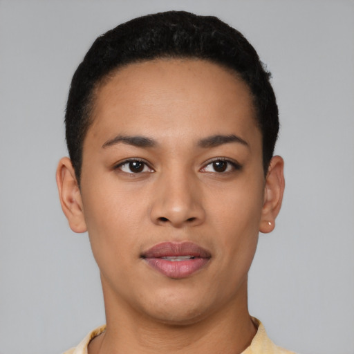 Joyful latino young-adult female with short  black hair and brown eyes