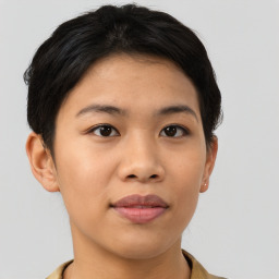 Joyful asian young-adult female with short  brown hair and brown eyes