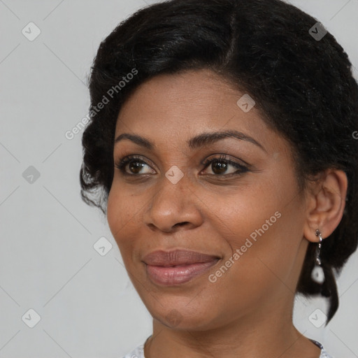 Joyful black young-adult female with short  brown hair and brown eyes