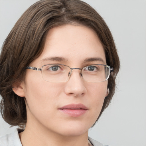 Neutral white young-adult female with medium  brown hair and grey eyes