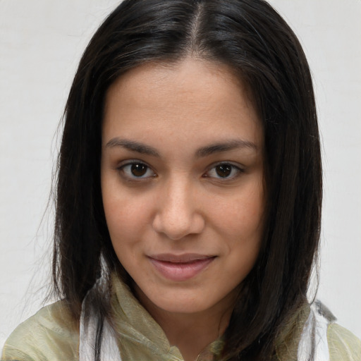 Joyful latino young-adult female with medium  brown hair and brown eyes
