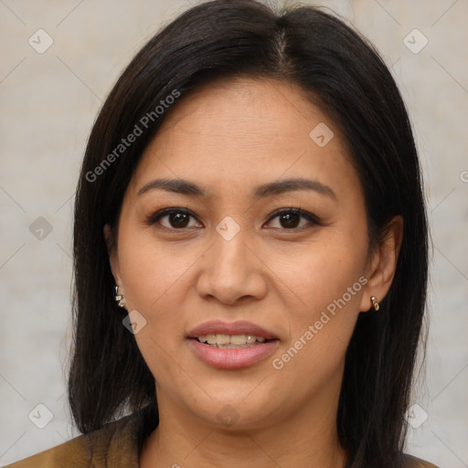 Joyful latino young-adult female with medium  brown hair and brown eyes